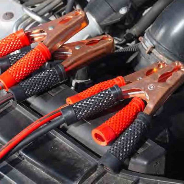 Image of vehicle engine with jumper cables