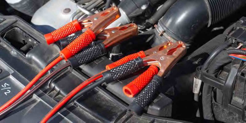 Image of vehicle engine with jumper cables