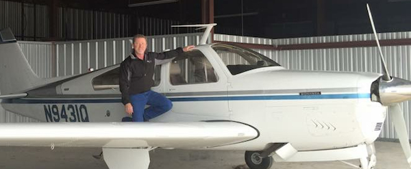 Photo of Brad Rohlfs and a Beech Bonanza airplane