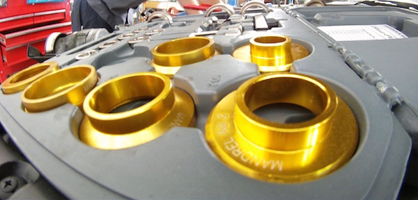 Image of new, shiny, gold engine parts